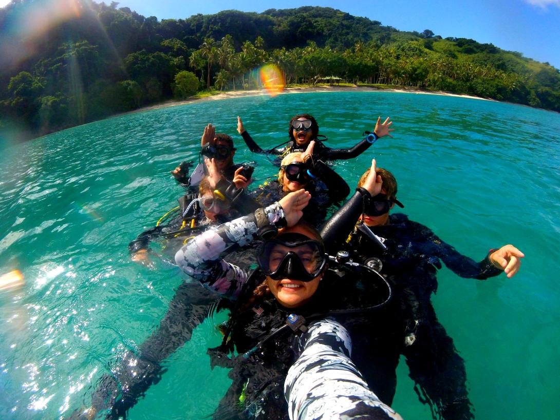Conservation volunteers participate in a dive to gather information for research in the South Pacific. A group of volunteers abroad go diving to collect scientific data on sharks in Fiji.